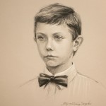 Charcoal and chalk drawing of boy on toned paper.